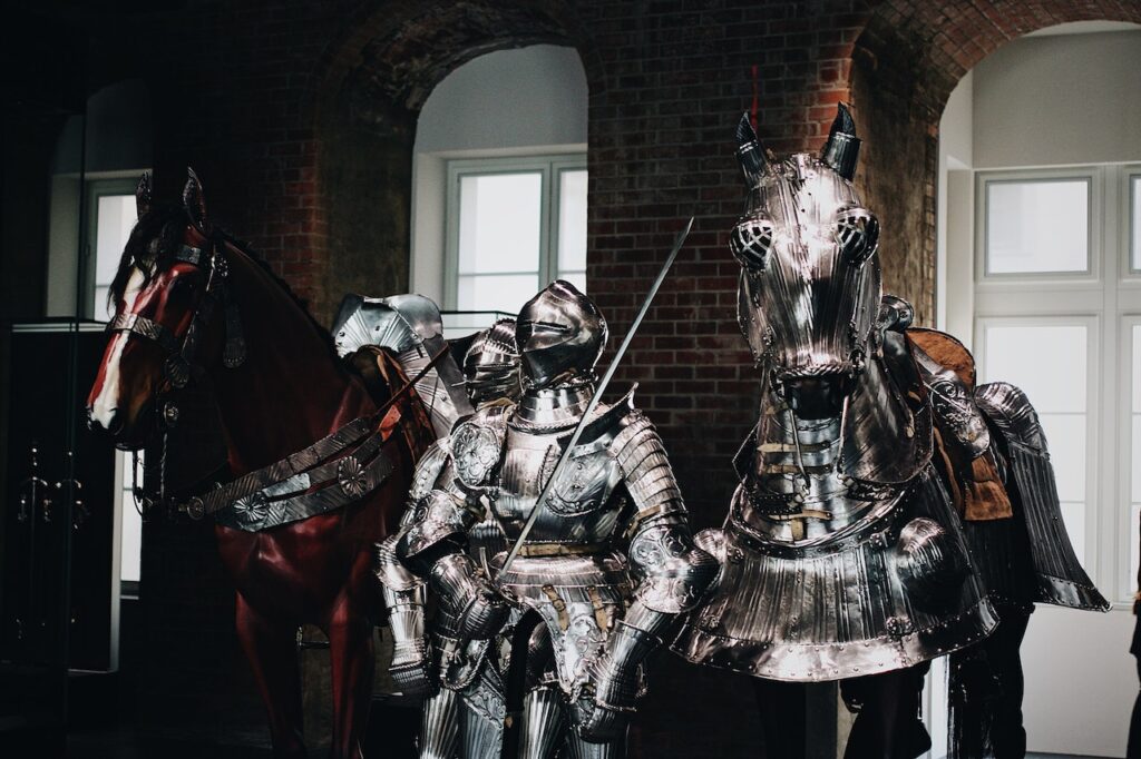 A picture of knight armor and his horse's armor in a museum.