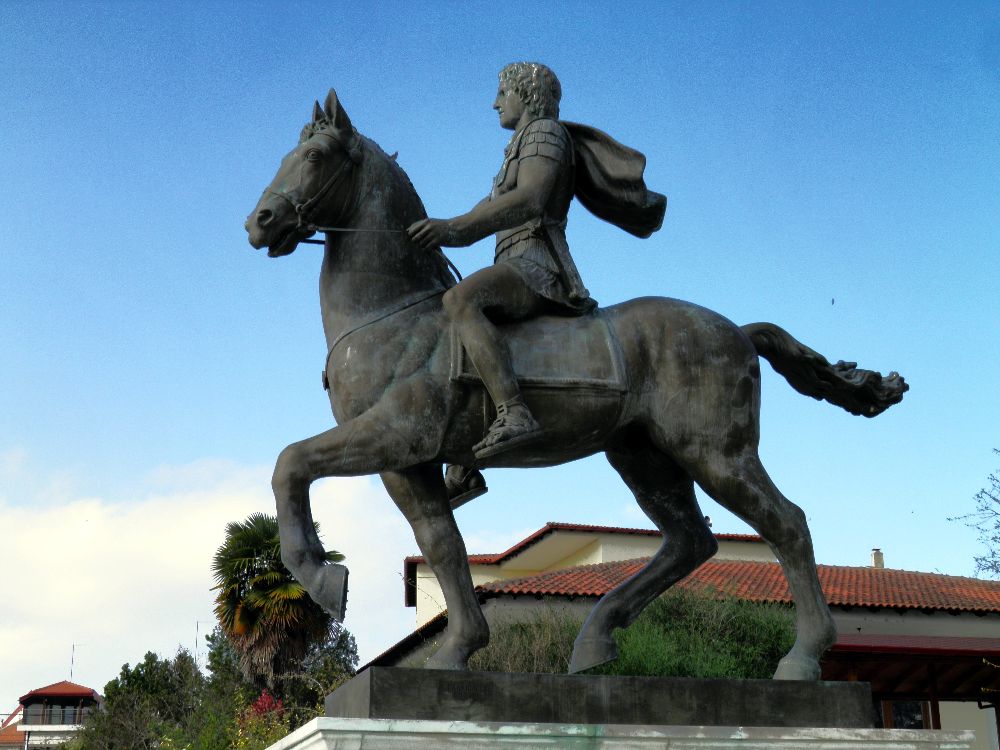 A statue of Alexander The Great riding Bucephalus and carrying a winged statue of Nike.
