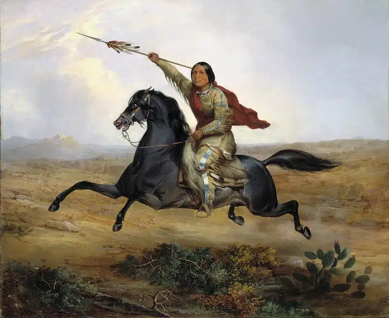 A black Native American horse with a rider who is holding a spear.